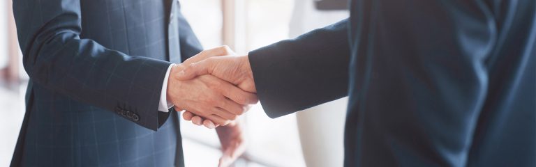 Business people shaking hands, finishing up a meeting